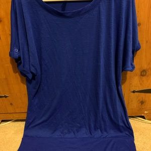 This top is tight around the hips and loose at the top